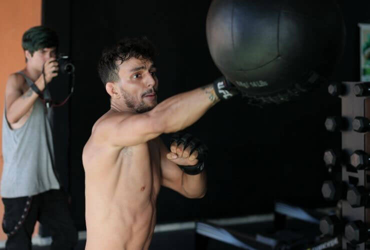 man hitting speed bag